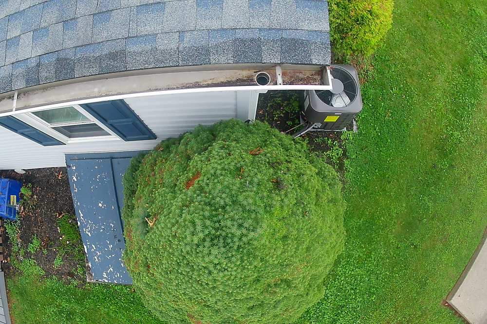 Clear downspout and clean gutter after professional gutter cleaning in Limerick, PA