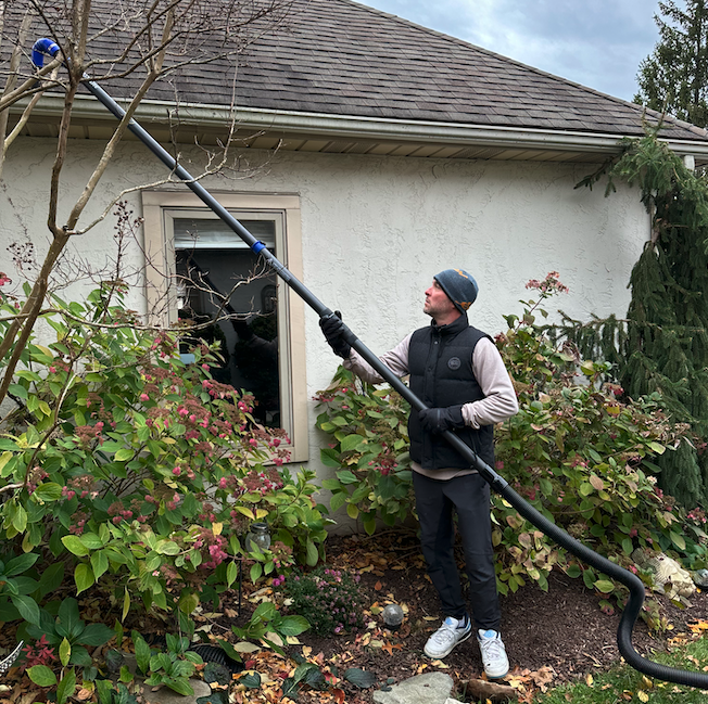 Vacuum gutter cleaning from the ground